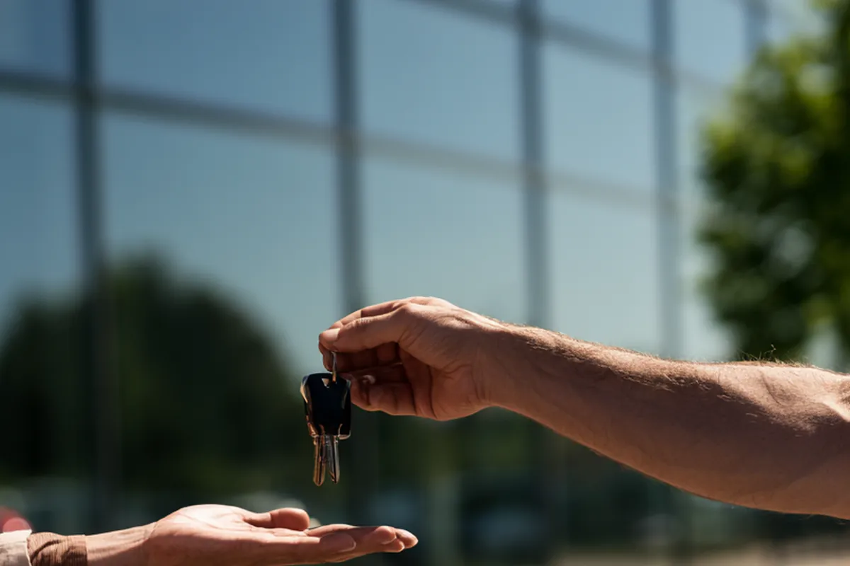 A prize winner receiving vehicle keys at the dealership